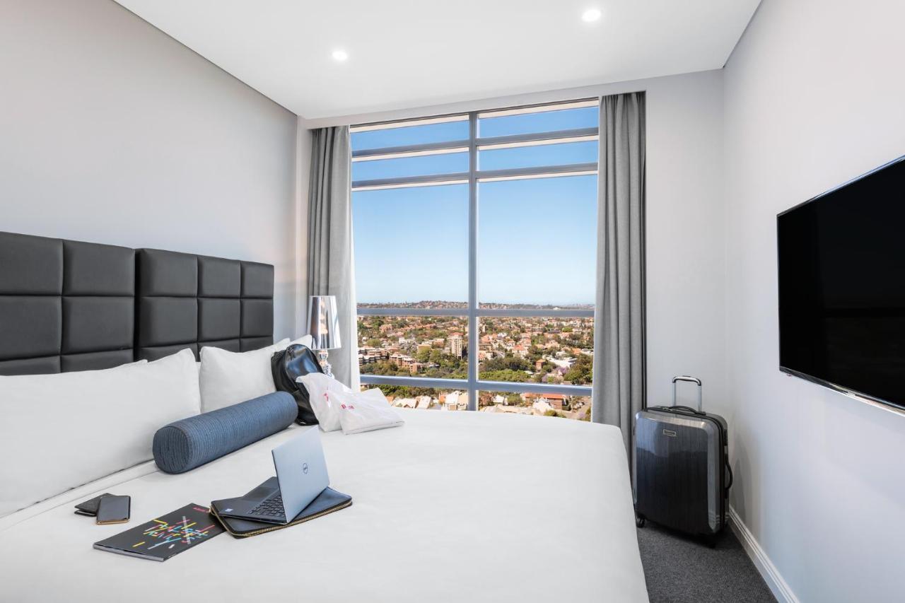 Meriton Suites North Sydney Exterior photo A typical bedroom